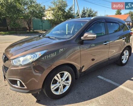 Коричневый Хендай их35, объемом двигателя 2 л и пробегом 115 тыс. км за 13000 $, фото 2 на Automoto.ua