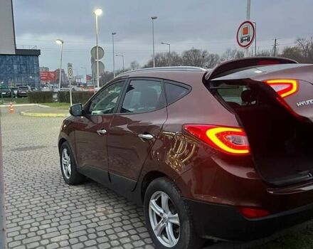 Коричневий Хендай іх35, об'ємом двигуна 2 л та пробігом 176 тис. км за 13700 $, фото 7 на Automoto.ua