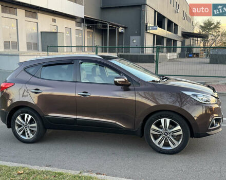 Коричневий Хендай іх35, об'ємом двигуна 2 л та пробігом 176 тис. км за 14500 $, фото 16 на Automoto.ua