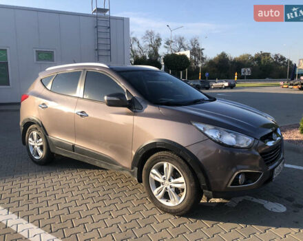 Коричневий Хендай іх35, об'ємом двигуна 2 л та пробігом 191 тис. км за 12500 $, фото 7 на Automoto.ua