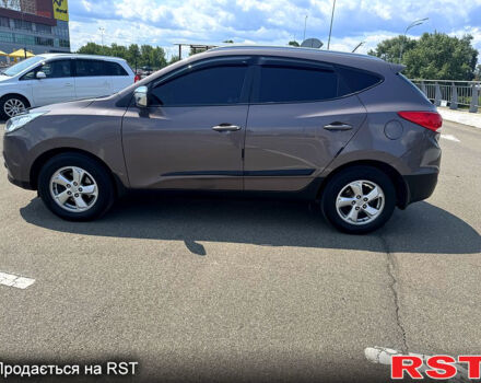 Коричневий Хендай іх35, об'ємом двигуна 1.7 л та пробігом 206 тис. км за 12600 $, фото 1 на Automoto.ua