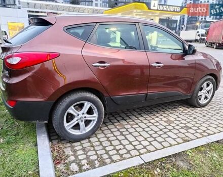 Коричневий Хендай іх35, об'ємом двигуна 2 л та пробігом 176 тис. км за 13700 $, фото 6 на Automoto.ua