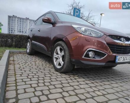 Коричневий Хендай іх35, об'ємом двигуна 2 л та пробігом 176 тис. км за 13700 $, фото 4 на Automoto.ua
