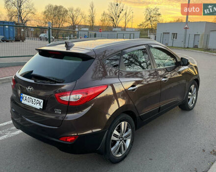 Коричневий Хендай іх35, об'ємом двигуна 2 л та пробігом 176 тис. км за 14500 $, фото 8 на Automoto.ua