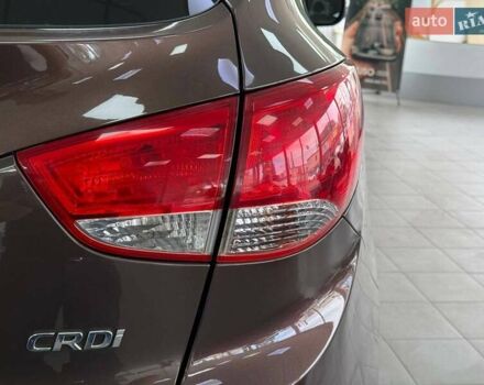Коричневий Хендай іх35, об'ємом двигуна 2 л та пробігом 155 тис. км за 12990 $, фото 11 на Automoto.ua