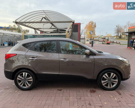 Коричневий Хендай іх35, об'ємом двигуна 2 л та пробігом 230 тис. км за 15300 $, фото 12 на Automoto.ua