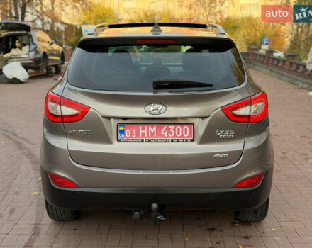 Коричневий Хендай іх35, об'ємом двигуна 2 л та пробігом 230 тис. км за 15300 $, фото 5 на Automoto.ua