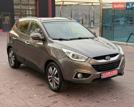 Коричневий Хендай іх35, об'ємом двигуна 2 л та пробігом 230 тис. км за 15300 $, фото 1 на Automoto.ua