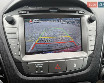 Коричневий Хендай іх35, об'ємом двигуна 2 л та пробігом 211 тис. км за 17400 $, фото 27 на Automoto.ua