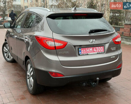 Коричневий Хендай іх35, об'ємом двигуна 2 л та пробігом 230 тис. км за 14300 $, фото 49 на Automoto.ua