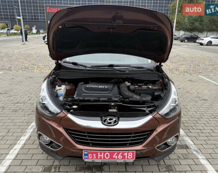 Коричневий Хендай іх35, об'ємом двигуна 2 л та пробігом 211 тис. км за 17400 $, фото 28 на Automoto.ua