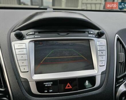 Сірий Хендай іх35, об'ємом двигуна 1.69 л та пробігом 308 тис. км за 11999 $, фото 18 на Automoto.ua