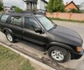 Черный Инфинити QX4, объемом двигателя 3.3 л и пробегом 150 тыс. км за 6000 $, фото 1 на Automoto.ua