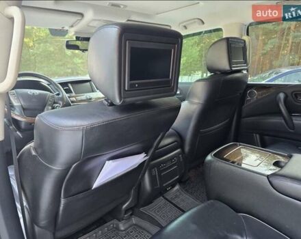 Белый Инфинити QX56, объемом двигателя 5.55 л и пробегом 127 тыс. км за 21000 $, фото 1 на Automoto.ua