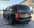 Черный Инфинити QX56, объемом двигателя 5.6 л и пробегом 150 тыс. км за 8900 $, фото 1 на Automoto.ua