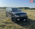 Черный Инфинити QX56, объемом двигателя 5.55 л и пробегом 200 тыс. км за 12000 $, фото 1 на Automoto.ua