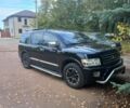 Чорний Інфініті QX56, об'ємом двигуна 5 л та пробігом 233 тис. км за 12000 $, фото 1 на Automoto.ua