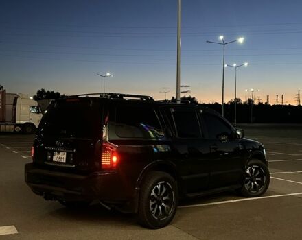 Черный Инфинити QX56, объемом двигателя 5.6 л и пробегом 240 тыс. км за 12500 $, фото 1 на Automoto.ua