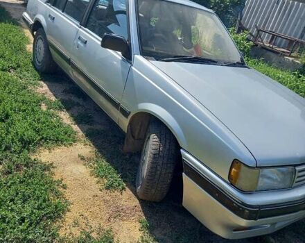 Серый Исузу Аска, объемом двигателя 2 л и пробегом 215 тыс. км за 1500 $, фото 2 на Automoto.ua