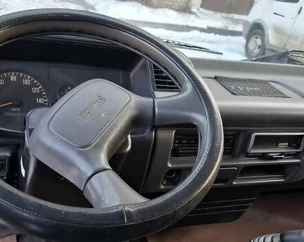 Белый Исузу НКР, объемом двигателя 4.75 л и пробегом 480 тыс. км за 6500 $, фото 7 на Automoto.ua