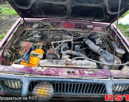 Красный Исузу Трупер, объемом двигателя 2.2 л и пробегом 300 тыс. км за 1900 $, фото 3 на Automoto.ua