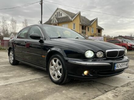 Черный Ягуар Х-Тайп, объемом двигателя 2.5 л и пробегом 142 тыс. км за 4200 $, фото 1 на Automoto.ua