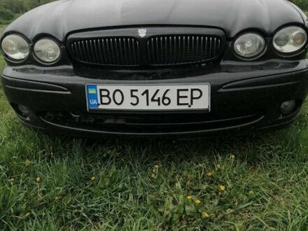 Черный Ягуар Х-Тайп, объемом двигателя 2.5 л и пробегом 300 тыс. км за 3850 $, фото 1 на Automoto.ua