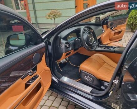 Чорний Ягуар Ікс Джей, об'ємом двигуна 5 л та пробігом 127 тис. км за 26000 $, фото 1 на Automoto.ua