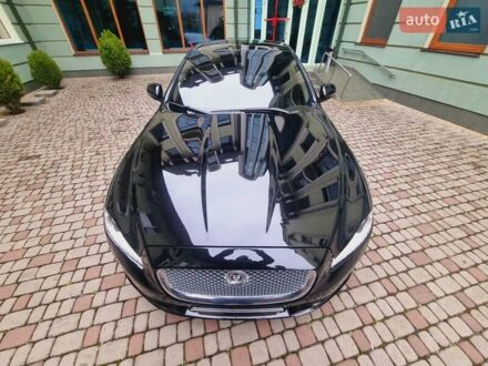 Черный Ягуар Икс Джей, объемом двигателя 5 л и пробегом 127 тыс. км за 26000 $, фото 1 на Automoto.ua