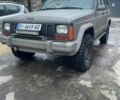 Белый Джип Чероки, объемом двигателя 4 л и пробегом 377 тыс. км за 4200 $, фото 1 на Automoto.ua