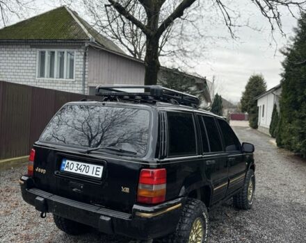 Чорний Джип Cherokee, об'ємом двигуна 5.2 л та пробігом 340 тис. км за 6300 $, фото 3 на Automoto.ua