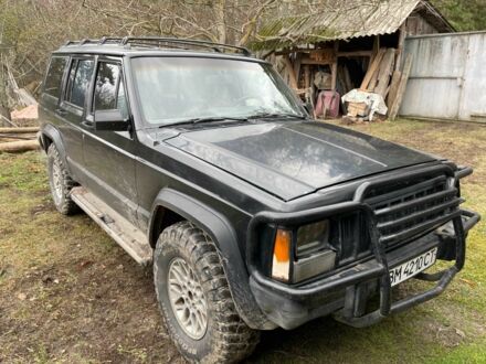 Чорний Джип Cherokee, об'ємом двигуна 4 л та пробігом 350 тис. км за 4200 $, фото 1 на Automoto.ua