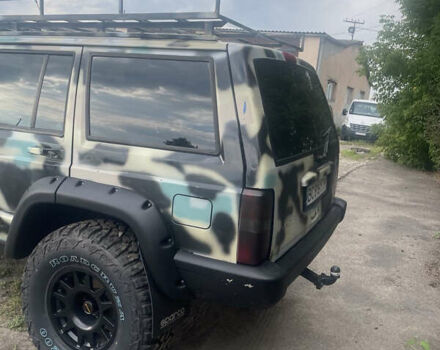 Синий Джип Чероки, объемом двигателя 2.5 л и пробегом 235 тыс. км за 12600 $, фото 2 на Automoto.ua