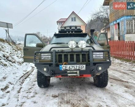 Зеленый Джип Чероки, объемом двигателя 4 л и пробегом 270 тыс. км за 7300 $, фото 1 на Automoto.ua