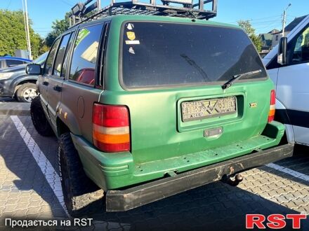 Зеленый Джип Чероки, объемом двигателя 5.2 л и пробегом 352 тыс. км за 4600 $, фото 1 на Automoto.ua