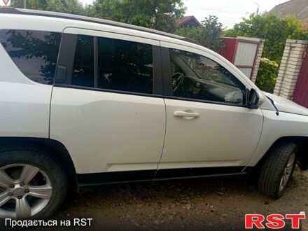 Білий Джип Compass, об'ємом двигуна 2 л та пробігом 150 тис. км за 8999 $, фото 1 на Automoto.ua