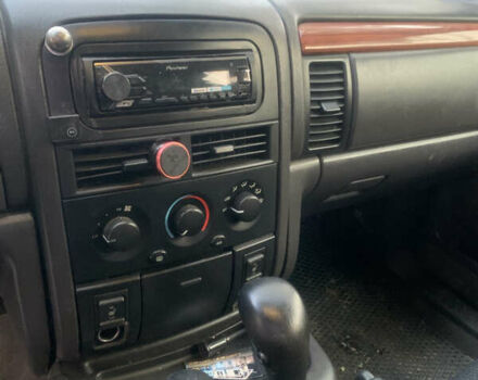 Білий Джип Grand Cherokee, об'ємом двигуна 4.7 л та пробігом 245 тис. км за 12500 $, фото 3 на Automoto.ua