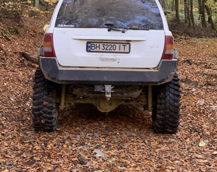 Білий Джип Grand Cherokee, об'ємом двигуна 4.7 л та пробігом 245 тис. км за 12500 $, фото 13 на Automoto.ua