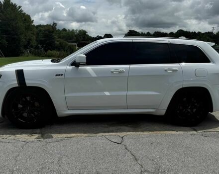 Білий Джип Grand Cherokee, об'ємом двигуна 6.4 л та пробігом 130 тис. км за 12800 $, фото 3 на Automoto.ua