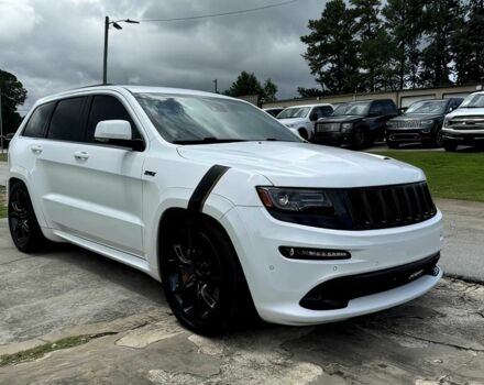 Білий Джип Grand Cherokee, об'ємом двигуна 6.4 л та пробігом 130 тис. км за 12800 $, фото 2 на Automoto.ua