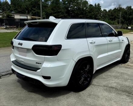 Білий Джип Grand Cherokee, об'ємом двигуна 6.4 л та пробігом 130 тис. км за 12800 $, фото 5 на Automoto.ua