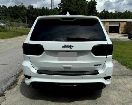 Білий Джип Grand Cherokee, об'ємом двигуна 6.4 л та пробігом 130 тис. км за 12800 $, фото 6 на Automoto.ua