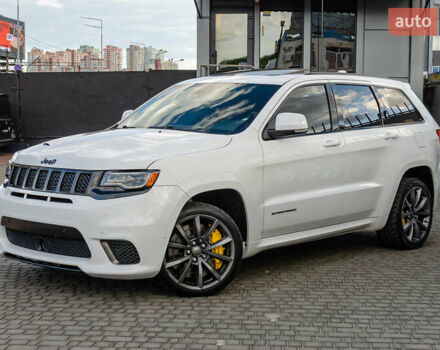 Білий Джип Grand Cherokee, об'ємом двигуна 6.2 л та пробігом 148 тис. км за 57700 $, фото 1 на Automoto.ua