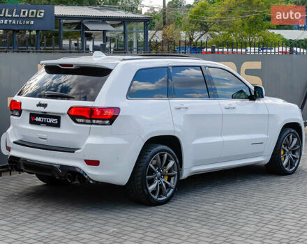 Білий Джип Grand Cherokee, об'ємом двигуна 6.2 л та пробігом 148 тис. км за 57700 $, фото 7 на Automoto.ua