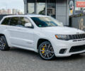Білий Джип Grand Cherokee, об'ємом двигуна 6.2 л та пробігом 148 тис. км за 57700 $, фото 1 на Automoto.ua