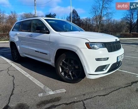 Белый Джип Гранд Чероки, объемом двигателя 5.65 л и пробегом 154 тыс. км за 28900 $, фото 2 на Automoto.ua