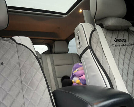 Білий Джип Grand Cherokee, об'ємом двигуна 5.65 л та пробігом 76 тис. км за 40000 $, фото 14 на Automoto.ua