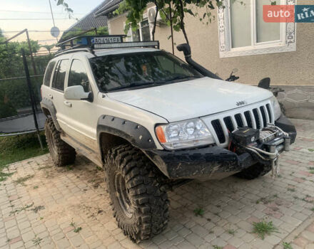Білий Джип Grand Cherokee, об'ємом двигуна 4.7 л та пробігом 245 тис. км за 13200 $, фото 1 на Automoto.ua