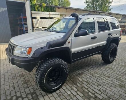 Білий Джип Grand Cherokee, об'ємом двигуна 4 л та пробігом 285 тис. км за 2777 $, фото 1 на Automoto.ua