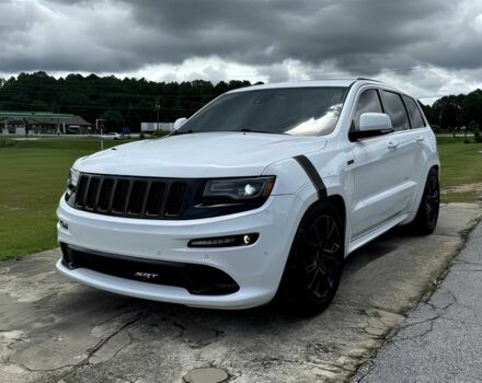 Білий Джип Grand Cherokee, об'ємом двигуна 6.4 л та пробігом 130 тис. км за 12800 $, фото 1 на Automoto.ua